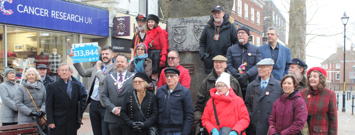 Group picture of attendees at the cheque presentation at the Friendship Stone 