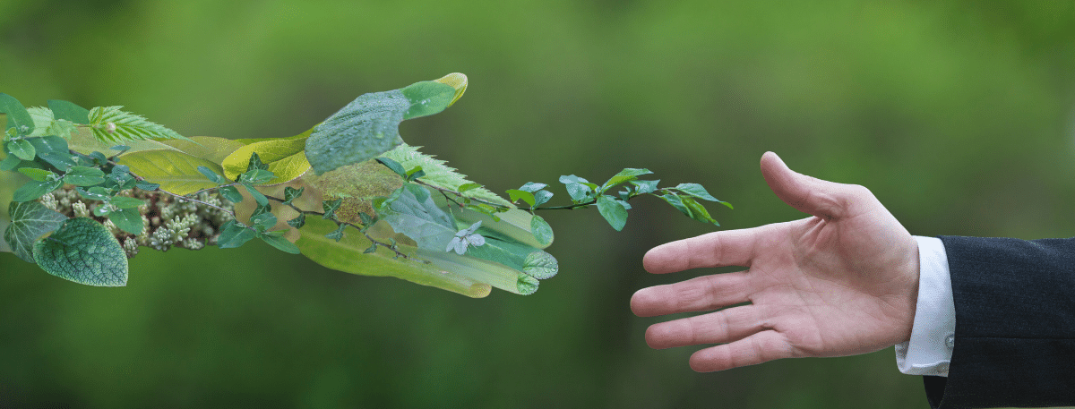 hand made of leaves shaking normal hand