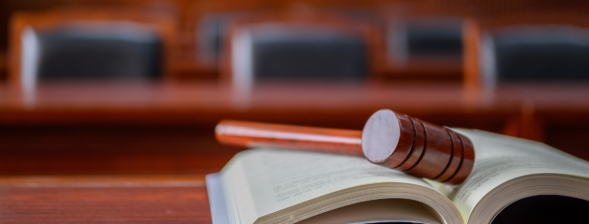 Gavel placed on a book in a court room