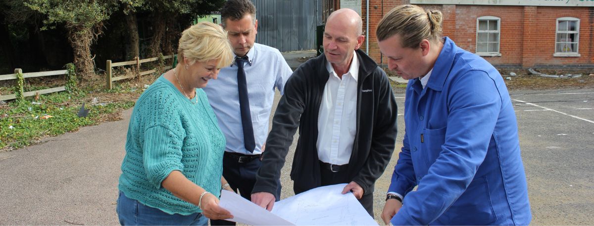 David Weir, Director at On Architecture (right) discusses preliminary plans for the Tannery Lane site with Ashford Borough Council Chief Executive Tracey Kerly, Cllr Bill Barrett, Portfolio Holder for Homes and Homelessness and Council Leader Cllr Noel Ovenden