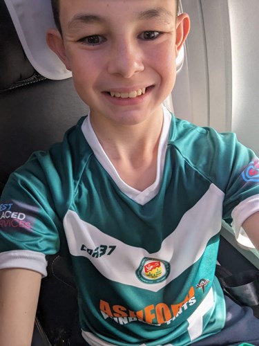 Callum proudly wearing his Ashford United shirt on route to the ceremony