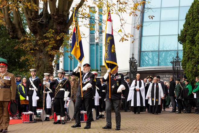 The Royal British Legion Standard Bearers entering Memorial Gardens